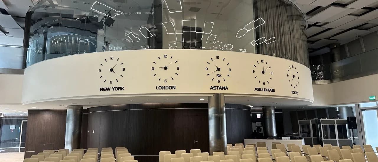 AIFC Trading Hall: world market clocks — New York, London, Astana, Abu Dhabi, Tokyo