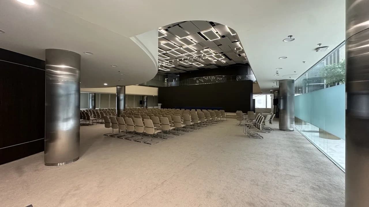 AIFC Trading Hall, rows of seats under a mirrored ceiling